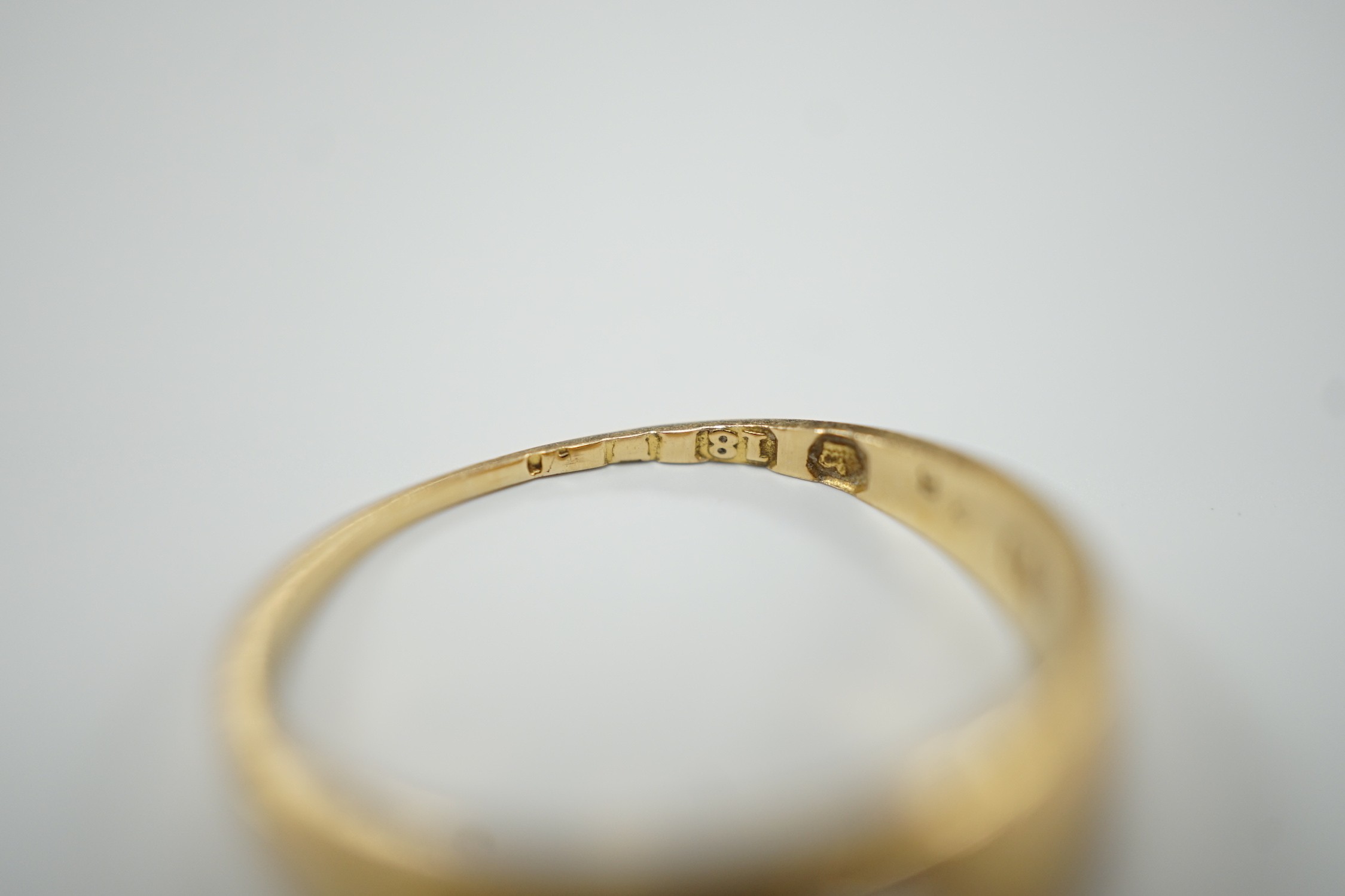An early 20th century 18ct gold and gypsy set solitaire diamond ring, size M, gross weight 3.2 grams